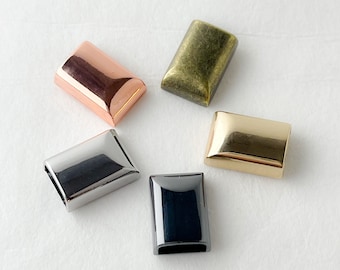 May include: Five metal rectangular slider buckles in different finishes: gold, silver, black, copper, and antique brass.