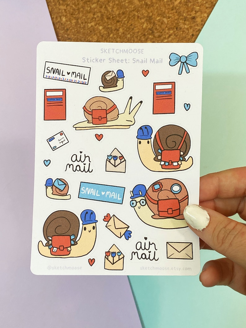 May include: A sticker sheet with a snail mail theme. The sheet features illustrations of snails carrying mail, mailboxes, envelopes, and the text "snail mail" and "air mail".