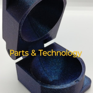 May include: A dark blue, 3D printed, hinged box with a round interior. The box is open and the text "Parts & Technology" is visible on the side.