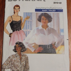 May include: Butterick sewing pattern 4476 showing illustrations of women's blouses and tops. The pattern includes a size range of 8-10-12. The sewing rating is Easy. The pattern is for couture.