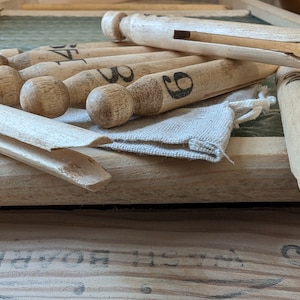 Handcrafted vintage washday pegs.