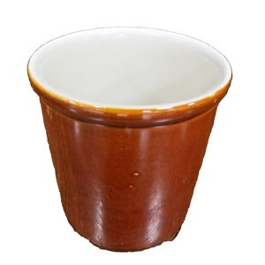 May include: A brown ceramic planter with a white interior. The planter has a rounded bottom and a slightly flared top.