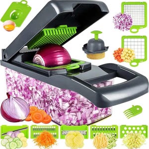 May include: A gray and green manual food chopper with a clear container. The chopper has a variety of interchangeable blades for slicing, dicing, and julienning vegetables. The image shows the chopper with a red onion inside and a container full of chopped onions. The image also shows a variety of other blades and a potato masher.