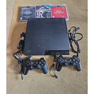 Consola Sony PlayStation 3 PS3 Slim de 160 GB CECH-3001A con 2 mandos y 3 juegos.