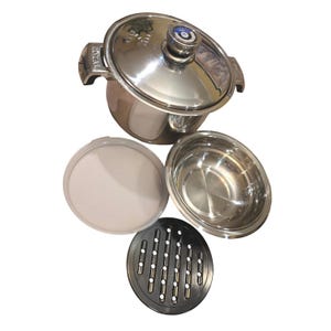 May include: A stainless steel cooking pot with a lid, a separate stainless steel bowl, a white plastic lid, and a black circular steaming rack with slots. The pot features the word ROYAL embossed on the side handles and a knob on the lid.