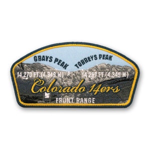 May include: A blue and yellow embroidered patch with a mountain scene and the text "Grays Peak 14,270 ft (4,349 m) - Torreys Peak 14,267 ft (4,349 m) Colorado 14ers Front Range".