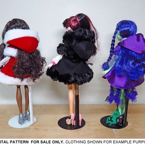 May include: Three fashion dolls wearing different outfits. The doll on the left is wearing a red and white hooded dress. The doll in the middle is wearing a black hooded dress with white polka dots. The doll on the right is wearing a purple hooded dress with green accents.