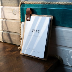 Wooden clip board with a Crazy Horse leather loop that doubles as a hanger