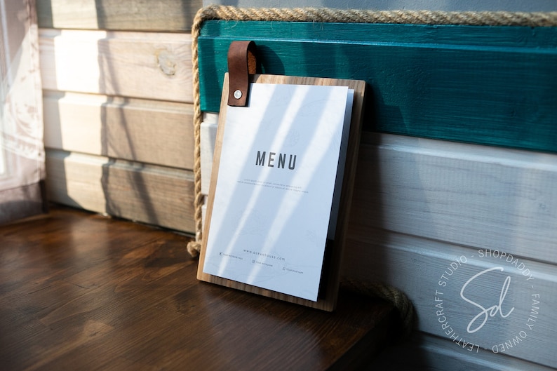 Wooden clip board with a Crazy Horse leather loop that doubles as a hanger
