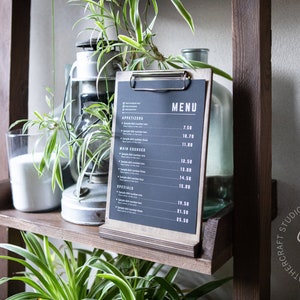 sign stand	wedding sign	clipboard stand	menu cover	menu holder	standing clipboard	tabletop sign holder	flyer holder	clipboard binder	decorative clipboard	retail sign holder	a4 a5 85x11 85x55	coffee cafe bar menu wholesale discounts, fast shipping