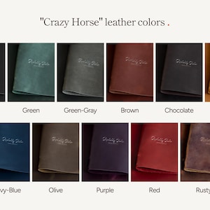 May include: A collection of twelve leather swatches labeled Crazy Horse leather colors, featuring shades of black, green, green-gray, brown, chocolate, ginger, navy-blue, olive, purple, red, and rusty, each embossed with a logo.