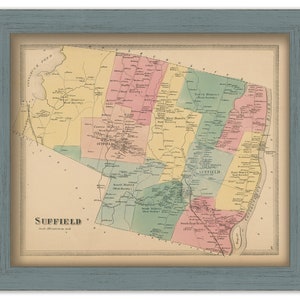 May include: A vintage map of Suffield, Connecticut, showing the different districts and towns within the area. The map is printed in various shades of yellow, green, pink, and blue, with black lines for roads and rivers. The map is framed in a light blue frame.