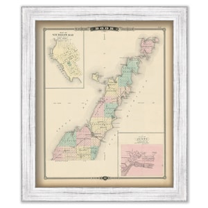 May include: An antique map of Door County, Wisconsin, with a detailed outline of the peninsula and surrounding waters. The map is divided into sections, each with a different color, and includes the names of towns and cities. The map is framed in a white frame.