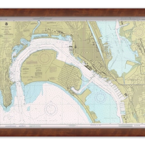 May include: A nautical chart of San Diego Bay, California, showing the coastline, waterways, and surrounding land features. The chart is printed in black and white with blue and green accents. The chart includes depth soundings, navigational aids, and other important information for mariners.