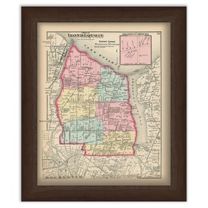 May include: A vintage map of the town of Irondequoit, New York, with color-coded districts and street names. The map is framed in a brown wood frame.