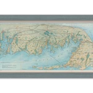 May include: A vintage map of the Buzzards Bay area of Massachusetts, showing the coastline, islands, and towns. The map is printed in blue, green, and brown tones and includes the text "Lines of N.Y.N.H.& H.R.R. common Steamboat Lines Principal Automobile Roads".