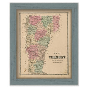 May include: An antique map of Vermont, printed in black and white with colored borders for each county. The map is framed in a light blue wood frame. The title "MAP OF VERMONT" is printed in black at the bottom of the map.