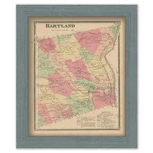 May include: A vintage map of Hartland, Connecticut, showing the different districts within the town. The map is printed in black and white with colored lines and areas to highlight the different districts. The map is framed in a light blue frame.