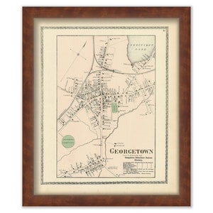 May include: An antique map of Georgetown, Massachusetts, printed in black and white with hand-colored details. The map shows streets, buildings, and landmarks, including a pond and cemetery. The title "Georgetown" is printed in large letters at the bottom of the map.