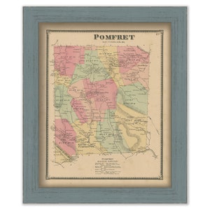 May include: Framed vintage map of Pomfret, with a blue wooden frame. The map features colorful districts and the name "Pomfret" at the top. The map is detailed with text and lines.