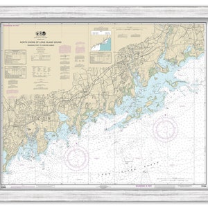 May include: A nautical chart of the North Shore of Long Island Sound, New York, from Execution Rocks to Huntington Harbor. The chart is printed in black and white with blue and green accents. It shows the coastline, islands, inlets, and other navigational features. The chart is framed in a white frame.
