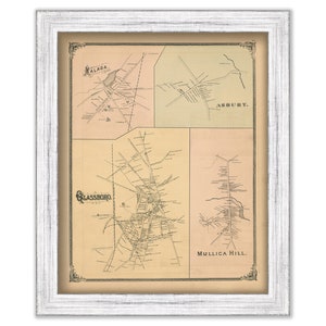May include: An antique map of Glassboro, Malaga, Asbury, and Mullica Hill, New Jersey. The map is printed in black and white on a cream-colored paper. The map is framed in a white frame.