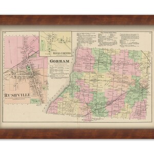 May include: A framed vintage map of Gorham and Rushville, featuring detailed cartography with various colors. The map is encased in a dark brown wooden frame with a cream-colored matting, suitable for home decor.