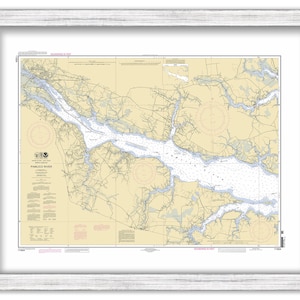 May include: A nautical chart of the Pamlico River in North Carolina. The chart is printed on paper and framed in a white frame. The chart shows the river's course, depth, and other navigational information.