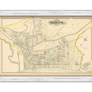 May include: An antique map of Bristol, Rhode Island, printed in black and white with yellow accents. The map shows the layout of the city with streets, buildings, and waterways. The title "Borough of Bristol" is printed at the top of the map.