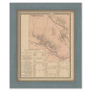 May include: An antique map of Chester, Pennsylvania, with a business directory listing various businesses and their addresses. The map is framed in a light blue wood frame.
