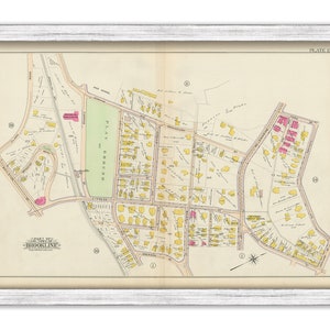 May include: A vintage map of Brookline, Massachusetts, showing streets, buildings, and parks. The map is printed in black and white with yellow and pink highlights. The map is titled "Part of the Town of Brookline" and "Plate 15."