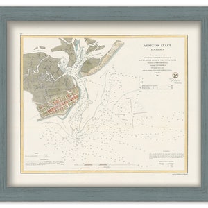 May include: A vintage nautical chart of Absecon Inlet, New Jersey. The chart is printed on paper and shows the coastline, waterways, and depths of the inlet. The chart is dated 1852 and includes a compass rose and a legend.
