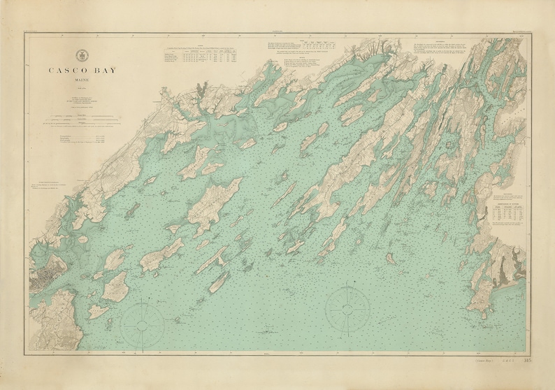 May include: A vintage map of Casco Bay, Maine, with detailed coastline and islands. The map is printed in shades of blue, green, and brown, with a compass rose in the lower left corner. The title "Casco Bay, Maine" is printed in the upper left corner.