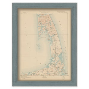 May include: A vintage map of Cape Cod, Massachusetts, printed in black, brown, and blue ink on a cream-colored paper. The map shows the coastline, roads, and towns of the Cape.