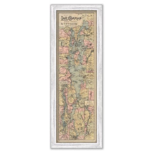 May include: A vintage map of Lake Champlain, New York, in a white frame. The map is printed in shades of green, blue, pink, and yellow, and includes details of the surrounding area.