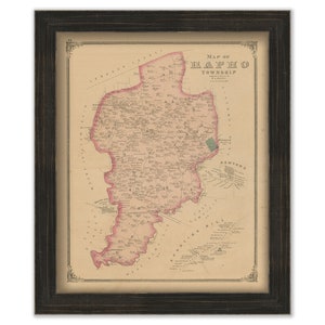 May include: An antique map of the township of  "Raritan" in New Jersey. The map is printed on cream-colored paper and features a pink outline of the township. The map is framed in a black frame.