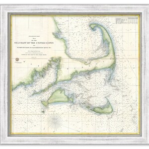 May include: A vintage map of the sea coast of the United States from 1858, showing the area from Plymouth, Mass. to Saco River, Maine. The map is printed on paper and framed in a white frame.