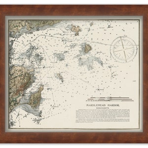 May include: A vintage nautical chart of Marblehead Harbor, Massachusetts. The chart shows the harbor's coastline, islands, and waterways. The chart is printed in black and white with some color accents. The chart includes a compass rose and a scale bar.