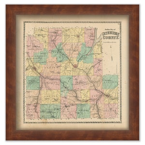 May include: An antique map of Guernsey County, Ohio, with a title in the upper right corner. The map is divided into townships, with each township labeled. The map is printed in black and white, with color accents for the townships. The map is framed in a brown wooden frame.