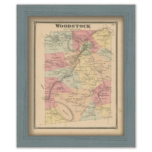 May include: A vintage map of Woodstock, New York, showing the different districts and towns. The map is printed in black and white with colored lines and areas. The title "WOODSTOCK" is printed at the top of the map.