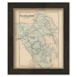 May include: An antique map of Flatlands, Long Island, New York, printed in black and white with a light brown background. The map shows the location of roads, waterways, and landmarks. The title "Flatlands" is printed in large, bold letters at the top of the map.