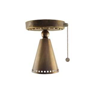 May include: A vintage-style ceiling fan light fixture in a bronze finish. The fixture has a circular top, a conical shade with small holes, and a pull chain with a ball at the end. The design is classic and decorative.