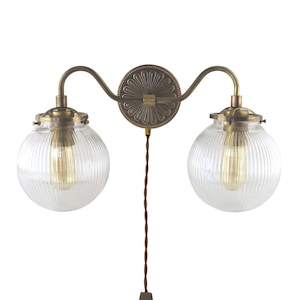 Elegant Plug-in Double Sconce with Reeded Glass Globes - Brass Wall Lighting