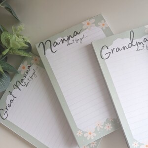 May include: Three green and white notepad sets with floral designs and the words "Nanna", "Grandma", and "Great Nanna" with the text "don't forget..." below each title.