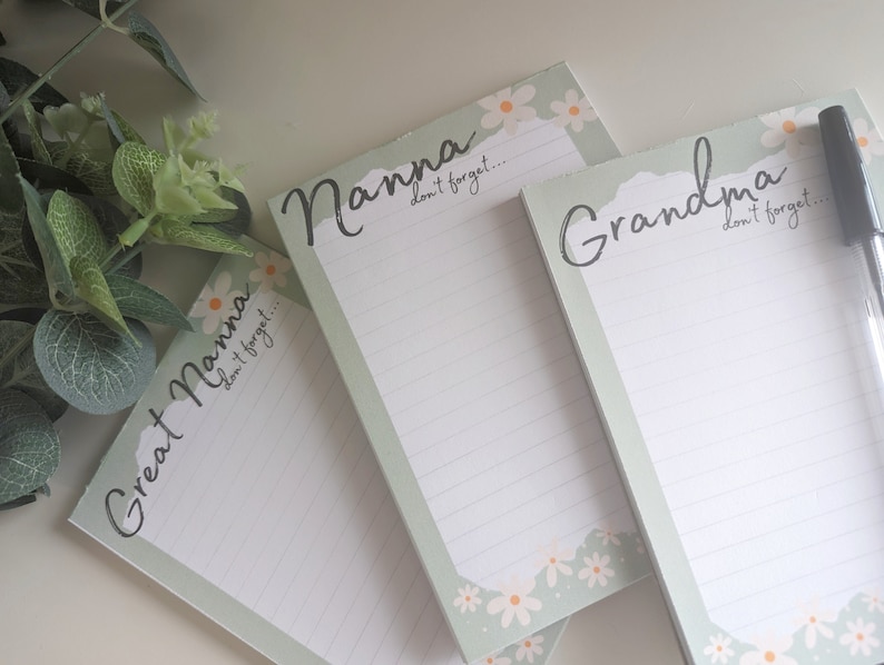 May include: Three green and white notepad sets with floral designs and the words "Nanna", "Grandma", and "Great Nanna" with the text "don't forget..." below each title.