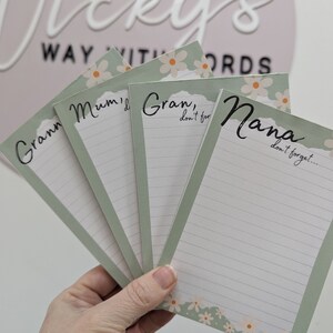 May include: Four green and white notepad sets with floral designs and lined paper. The notepads have the text "Gran, don't forget...", "Nana, don't forget...", "Mum, I...", and "Gran, don't for..." printed on them.