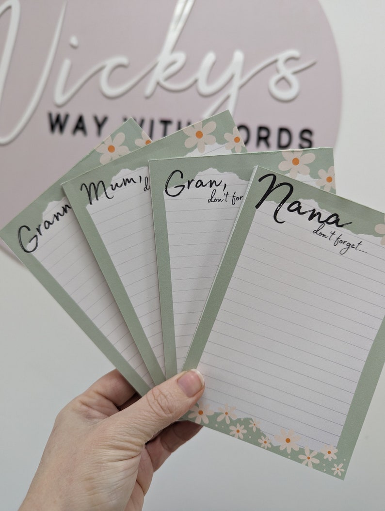 May include: Four green and white notepad sets with floral designs and lined paper. The notepads have the text "Gran, don't forget...", "Nana, don't forget...", "Mum, I...", and "Gran, don't for..." printed on them.