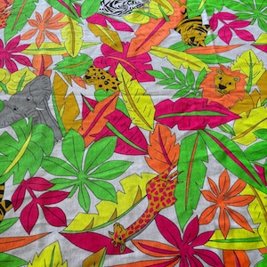 May include: A fabric featuring a vibrant jungle pattern with illustrations of elephants, zebras, tigers, leopards, lions, and giraffes interspersed among colorful neon green, hot pink, orange, and yellow tropical leaves on a white background.