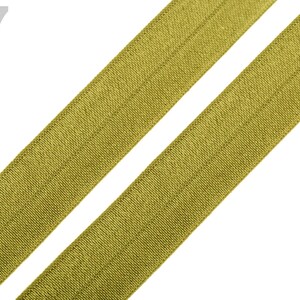 May include: A close-up of two pieces of olive green elastic ribbon. The ribbon has a subtle sheen and is folded in half.