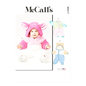 Könnte beinhalten: Ein Baby in einem rosa Kapuzen-Overall mit großen, ohrenartigen Klappen. Das Bild zeigt auch Illustrationen von zwei weiteren Baby-Overalls. Das McCall's-Logo befindet sich oben links und die Modellnummer M8617 oben rechts.